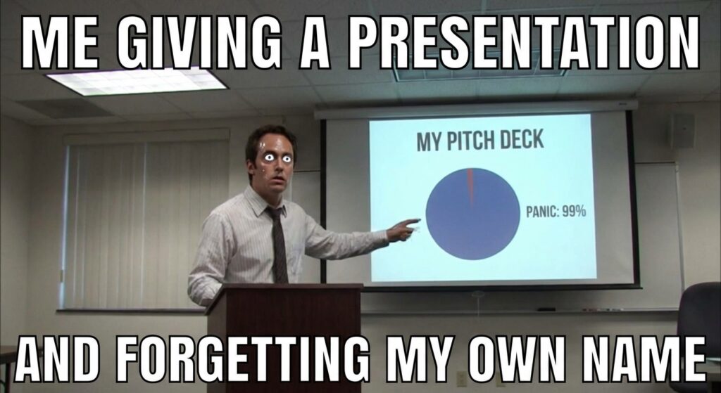 A funny GIF or meme of someone nervously giving a presentation, maybe from a famous movie like The Office or a scene from Silicon Valley series showing their pitch deck.